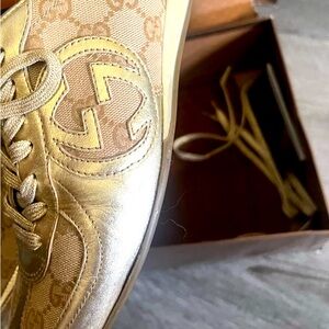 Gold Gucci sneakers
